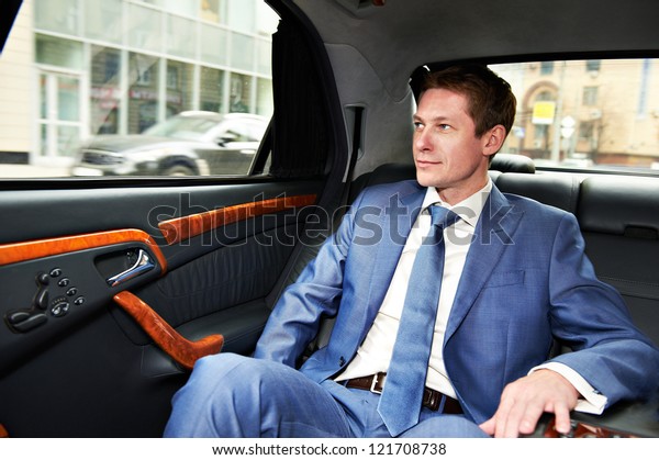 Business man goes to the\
executive car