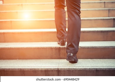 Business Man Going Up The Stairs  In A Rush Hour To Work. Hurry Time.