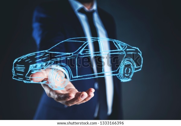 business man hand car model\
in screen