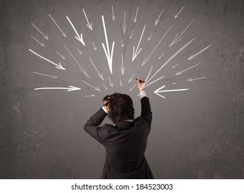 Business man with hand drawn arrows pointing at his head concept - Shutterstock ID 184523003
