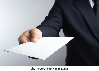 Business Man Hand Holding Envelope On White Background