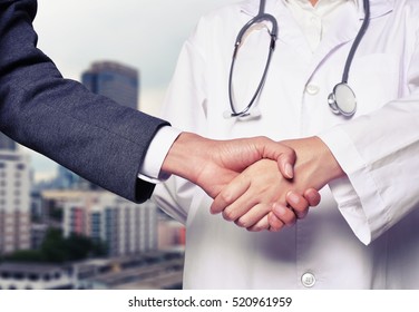 Business Man Hand Shake With Doctor