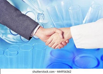 Business Man Hand Shake With Researcher , Scientist Research At Science Lab 