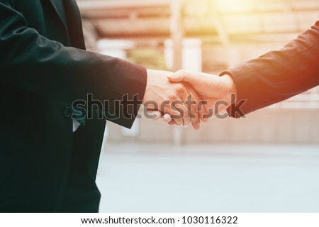 business man hand shaking closing a deal ,business team partnership concept