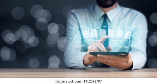 business man hand tablet with transfer file - Shutterstock ID 1912592797