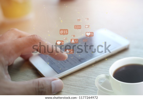 Business man hand using smartphone on mobile phone with email icon, concept