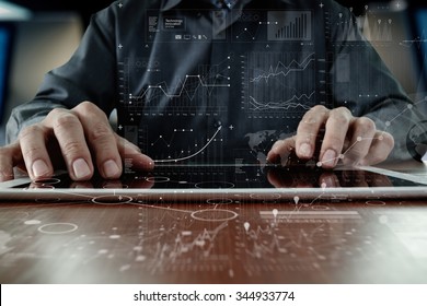 business man hand working on laptop computer with digital layer business strategy and social media diagram on wooden desk - Shutterstock ID 344933774