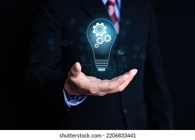 Business Man Hands Holding Light Bulb For Concept New Idea Concept With Innovation And Inspiration,inovation Concept 