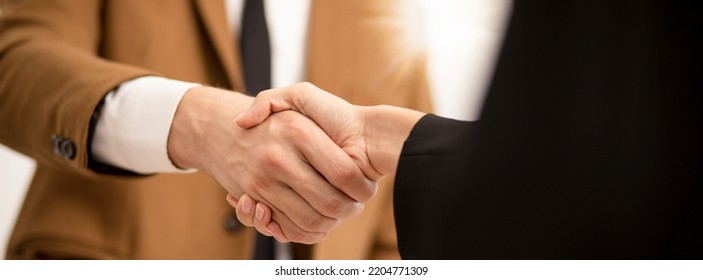 Business Man Hands Shaking ,Successful Businessman Handshake After Good Deal For Both Companies Businessmen Handshaking After Finishing Up Meeting.