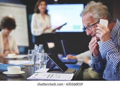 Business Man Having An Emergency Phone Call 
