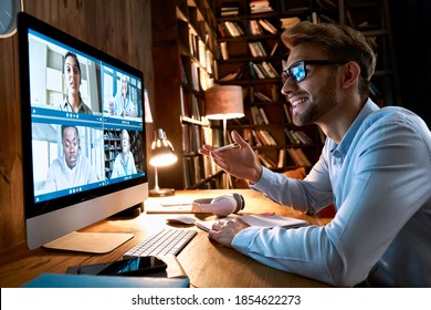 Business Man Having Virtual Team Meeting On Video Conference Call Using Computer. Social Distance Worker Working From Home Office Talking To Diverse Colleagues In Remote Videoconference Online Chat.