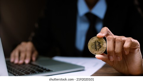 Business man hold bitcoin currency in finance exchange trade for digital technology money. Trander invest saving money in crypto electronic payment market and online internet banking, close up - Powered by Shutterstock