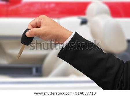 business man hold car key
