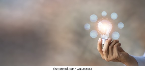 Business Man Hold Glowing Light Bulb, Creative New Idea. Innovation, Brainstorming, Strategizing To Make The Business Grow And Be Profitable,execution, Strategy Planning And Profit Management Concept.