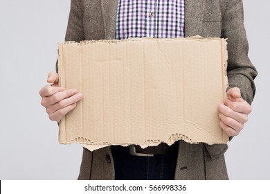 Business Man Holding Up Blank Cardboard Sign