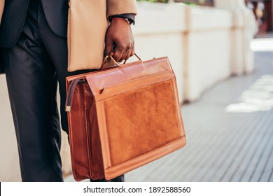 Business Man Holding A Briefcase.