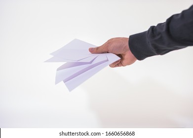 The business man is holding the document on the white background - Shutterstock ID 1660656868