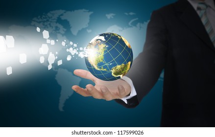 Business Man Holding Earth globe with digital Data.  Elements of this image furnished by NASA