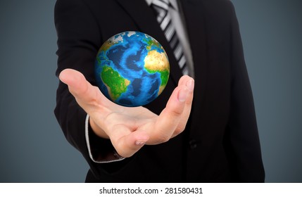 Business man holding earth in his hand (Elements of this image furnished by NASA) - Shutterstock ID 281580431