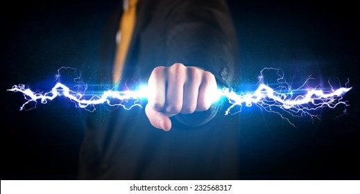 Business Man Holding Electricity Light Bolt In His Hands Concept