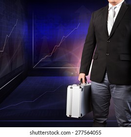 Business Man Holding Metal Strong Briefcase Standing Against Indicator Graphic In Meeting War Room Use For Top Secret And Competition Strategy To Successful