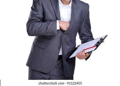 Business Man Holding A Paper Holder In One Hand And Reaching In His Pocket With Another