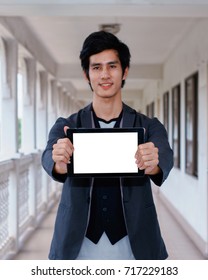 Business Man Holding And Shows Touch Screen Tablet Pc