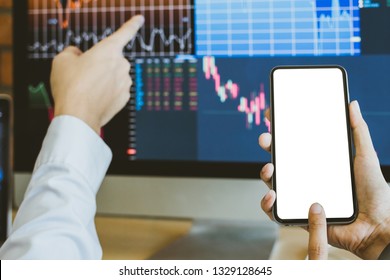 Business Man Holding Smart Phone White Screen And Pointing And Look Directions Change Average Line Share Price Movement Stock Trading In The Up And Down. On Display Computer. 