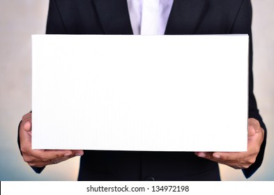 Business Man Holding White Box