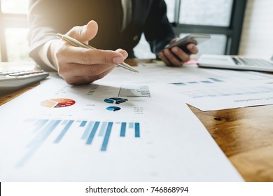 Business Man Investment Consultant Analyzing Company Annual Financial Report Balance Sheet Statement Working With Documents Graphs. Concept Picture Of Business, Market, Office, Tax.