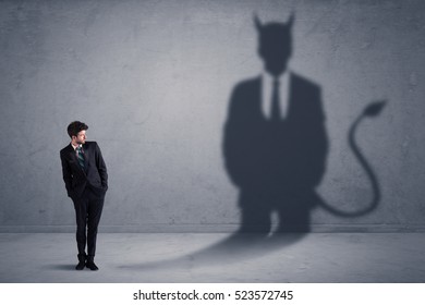 Business man looking at his own devil demon shadow concept background - Shutterstock ID 523572745