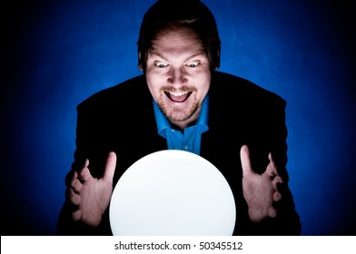 A Business Man Looking Into The Future In A Crystal Ball