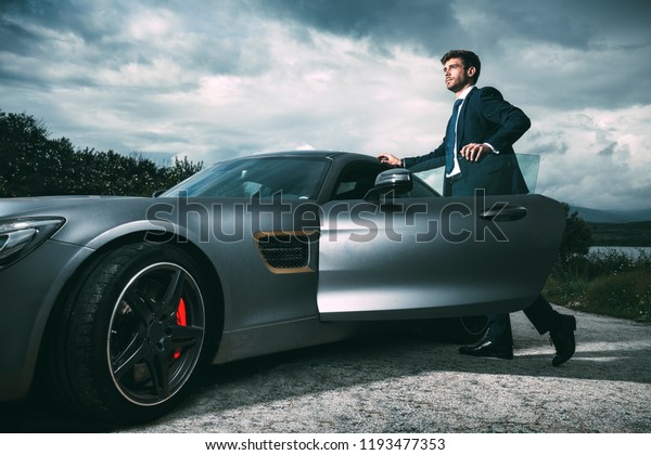 Business man in luxury\
car