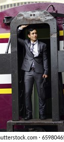 The Business Man With Luxury Suit  Standing On The Local Subway Train Door.
Young Man Standing At The End Of Train.  Business Trip On The Subway Train.