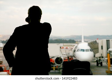 Business Man Making A Last Important Call Before His Flight Is Leaving...