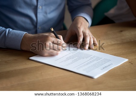 Business man manager customer hand sign contract, male client put written signature on legal paper subscribe document fill form make sale purchase commercial insurance deal agreement, close up view