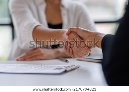 Business man offer and give hand for handshake in office. Successful job interview. Apply for loan in bank. Salesman, bank worker or lawyer shake for deal, agreement or sale. Increase of salary.