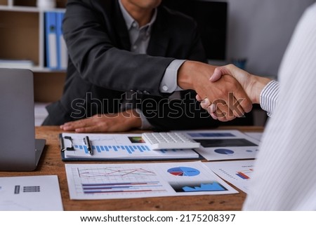 	
Business man offer and give hand for handshake in office. Successful job interview. Apply for loan in bank. Salesman, bank worker or lawyer shake for deal, agreement or sale. Increase of salary.