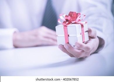 Business Man Offering A Gift