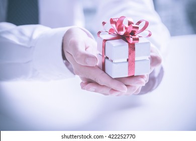 Business Man Offering A Gift