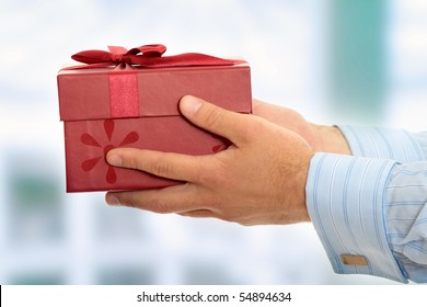 Business Man Offering A Gift