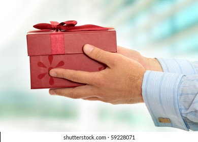 Business Man Offering A Gift