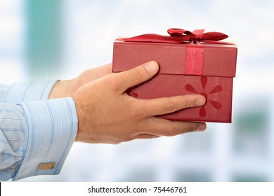 Business Man Offering A Gift