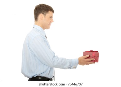 Business Man Offering A Gift Over A White Background