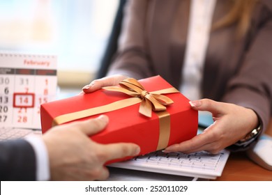 Business Man Offering A Gift To A Woman