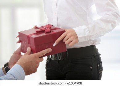 Business Man Offering A Gift To A Woman