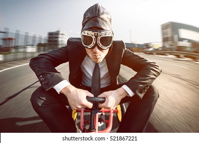 Business Man On A Pedal Car