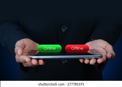 Business man with online and offline button