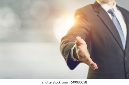 Business Man Open Hand Ready To Seal A Deal, Partner Shaking Hands, Shaking Hands, Copy Space. Sunlight Effect.