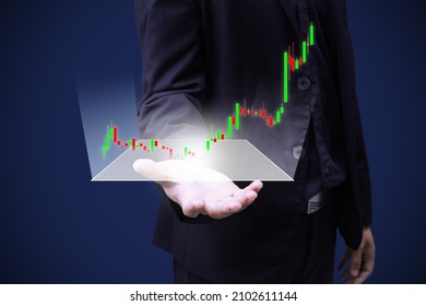 Business Man Person Hand With Graph Float Out From Hologram In Concept Of Finance Stock Trade And Growth Of Wealth